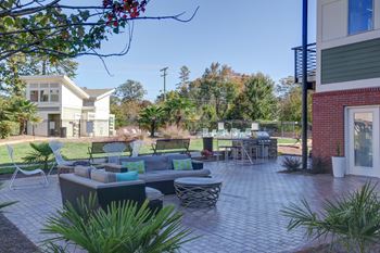 outdoor lounge with seating and firepit